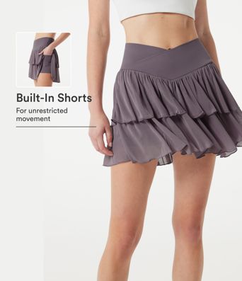Falda mini de tenis 2 en 1 de malla a capas, cintura alta cruzada, de corte fluido, con bolsillos