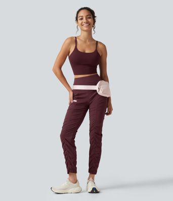 Pantalones ajustados de running de talle alto con fruncido, secado rápido y bolsillos.