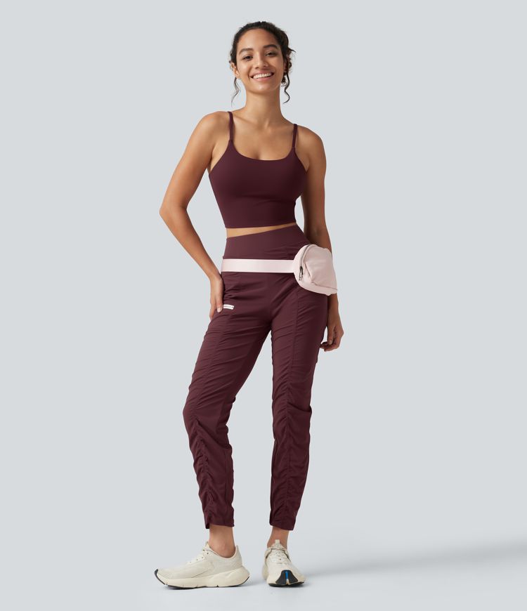 Pantalones ajustados de running de talle alto con fruncido, secado rápido y bolsillos.