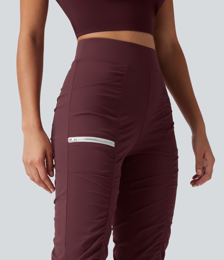 Pantalones ajustados de running de talle alto con fruncido, secado rápido y bolsillos.