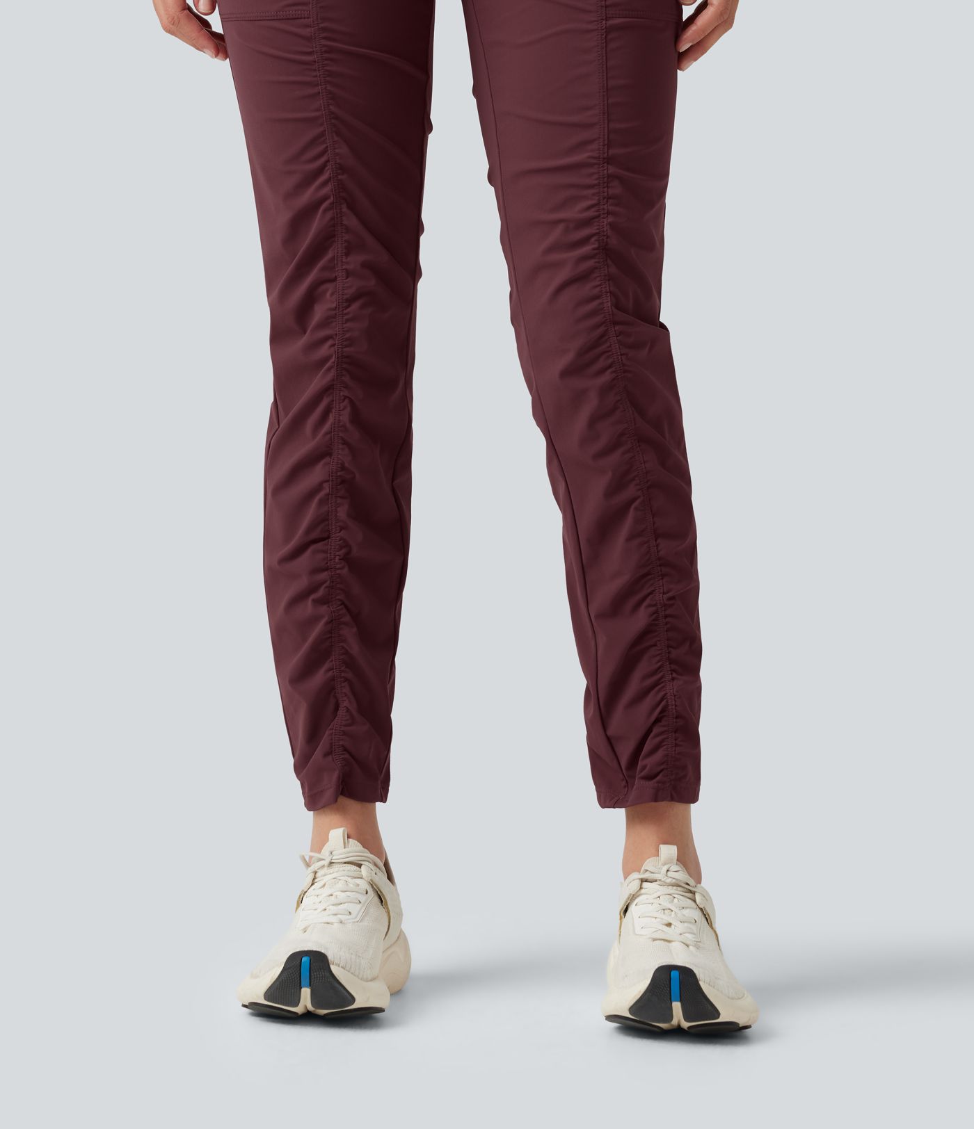 Pantalones ajustados de running de talle alto con fruncido, secado rápido y bolsillos.