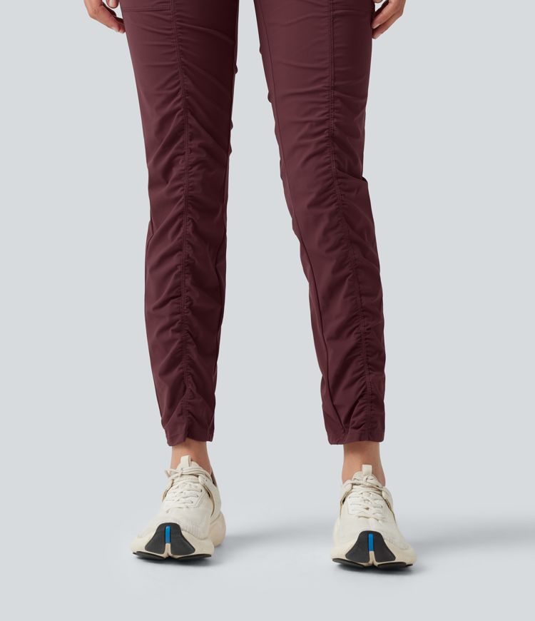 Pantalones ajustados de running de talle alto con fruncido, secado rápido y bolsillos.