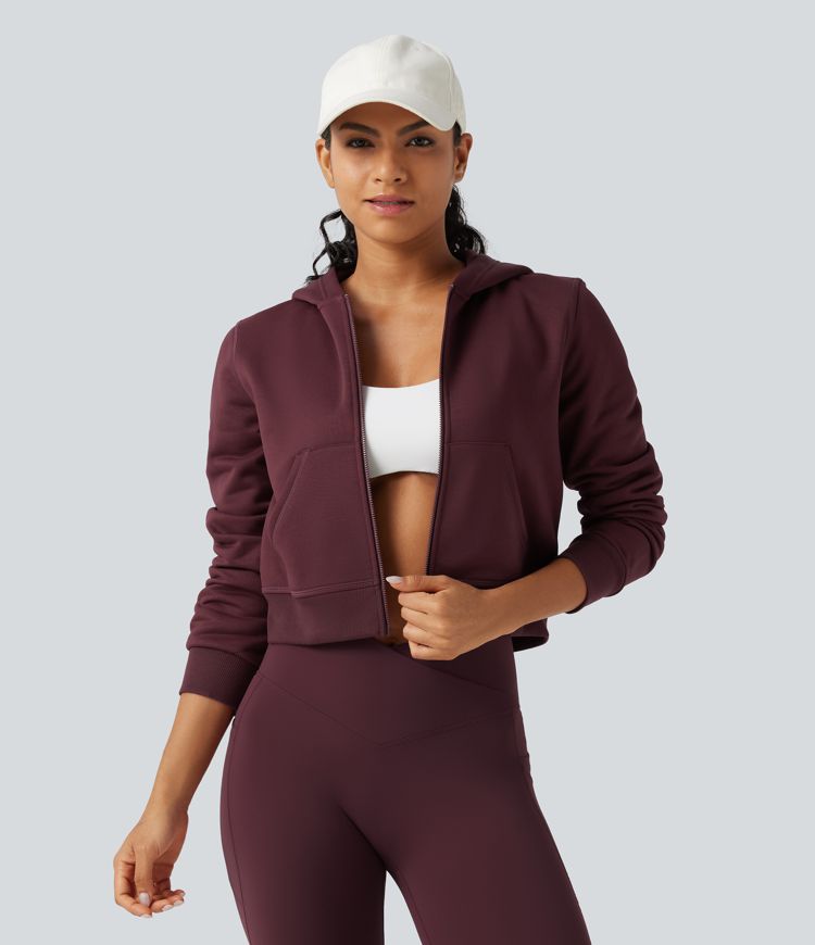 Fleece-Trainingsjacke mit Kapuze, Seitentaschen und langen Ärmeln Fleece-Trainingsjacke mit Kapuze, Seitentaschen und langen Ärmeln