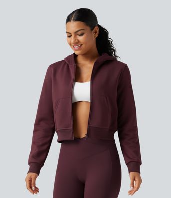 Fleece-Trainingsjacke mit Kapuze, Seitentaschen und langen Ärmeln Fleece-Trainingsjacke mit Kapuze, Seitentaschen und langen Ärmeln