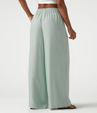 Pantalon large fluide taille haute en lin mélangé avec poches et liens latéraux Pantalon large fluide taille haute en lin mélangé avec poches et liens latéraux