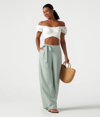Pantalon large fluide taille haute en lin mélangé avec poches et liens latéraux Pantalon large fluide taille haute en lin mélangé avec poches et liens latéraux