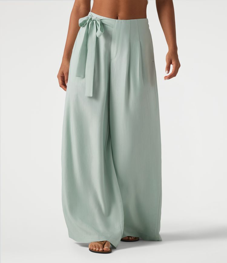 Pantalon large fluide taille haute en lin mélangé avec poches et liens latéraux Pantalon large fluide taille haute en lin mélangé avec poches et liens latéraux