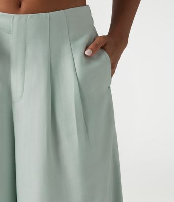 Pantalon large fluide taille haute en lin mélangé avec poches et liens latéraux Pantalon large fluide taille haute en lin mélangé avec poches et liens latéraux
