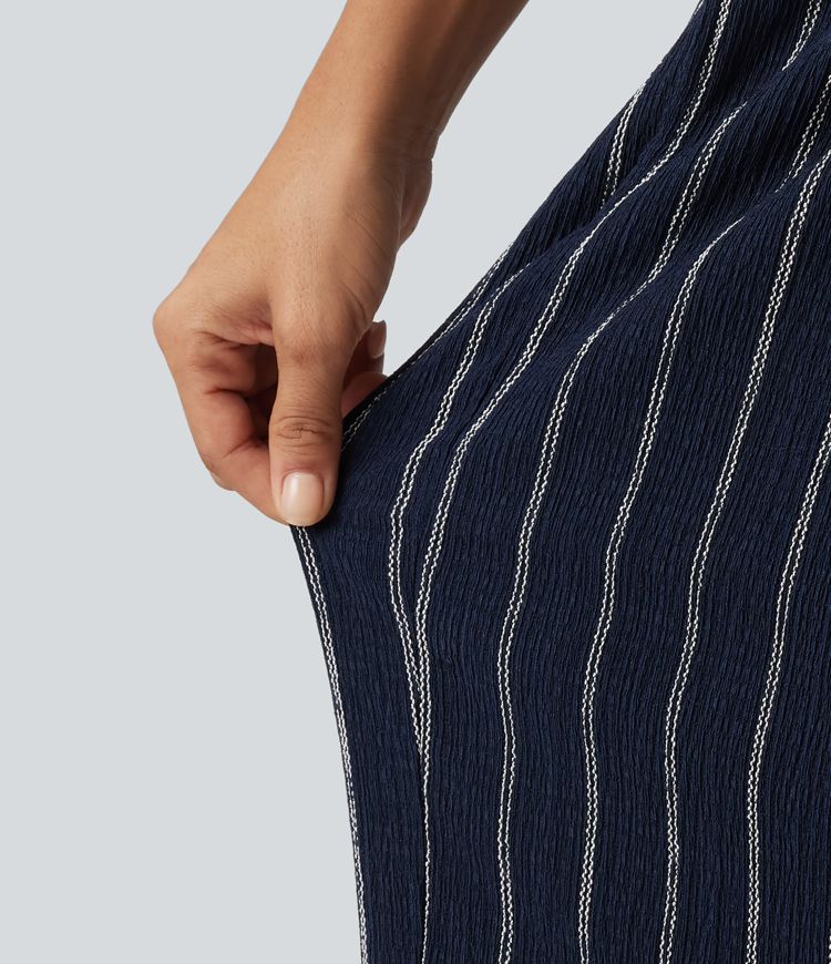 Lässige Hose mit hohem Bund, mehreren Taschen, Streifen und abgerundetem Saum