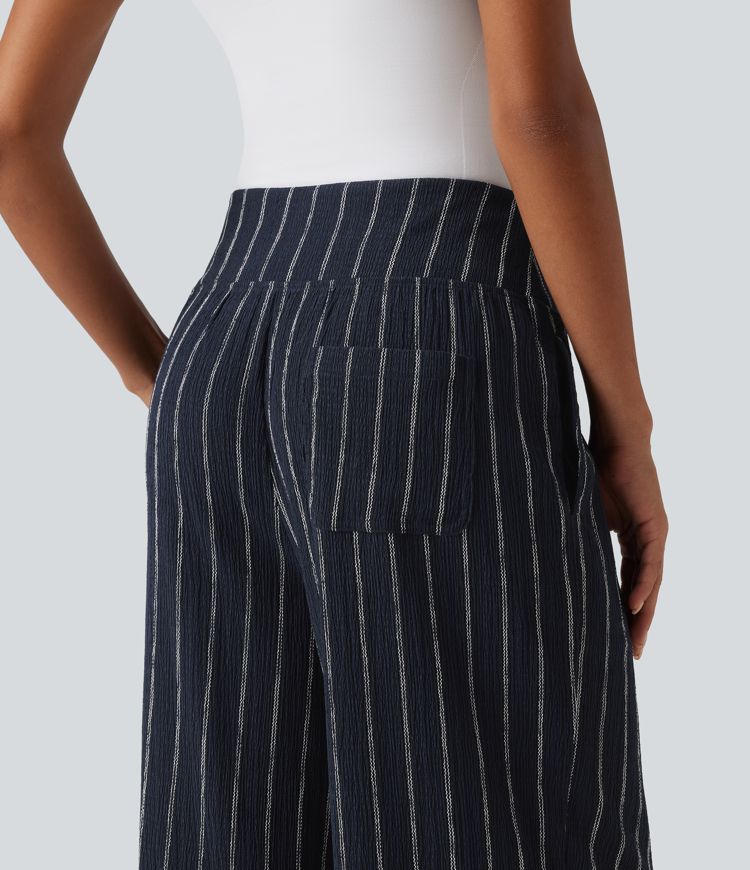 Lässige Hose mit hohem Bund, mehreren Taschen, Streifen und abgerundetem Saum