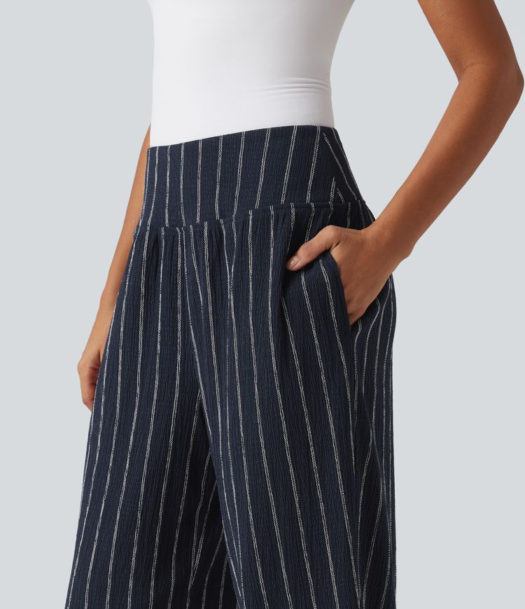 Lässige Hose mit hohem Bund, mehreren Taschen, Streifen und abgerundetem Saum