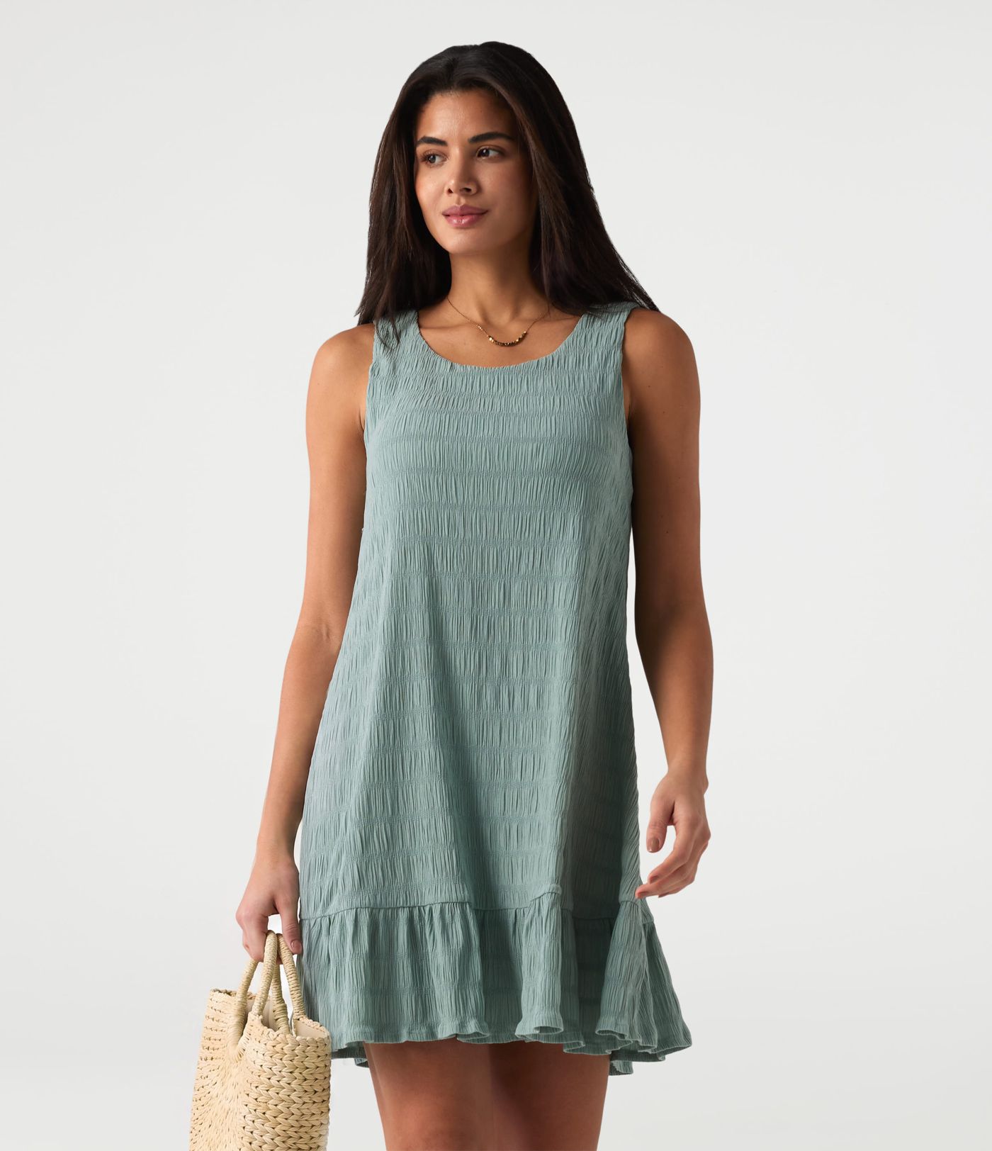 Vestido mini casual sin mangas con escote redondo, sujetador incorporado y bajo con volantes Vestido mini casual sin mangas con escote redondo, sujetador incorporado y bajo con volantes