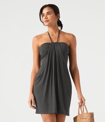 Vestido mini de estilo resort con escote halter que se anuda en la espalda y bolsillos Vestido mini de estilo resort con escote halter que se anuda en la espalda y bolsillos
