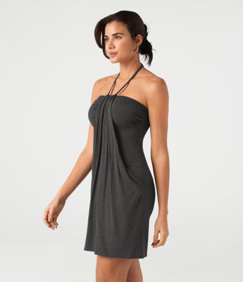 Vestido mini de estilo resort con escote halter que se anuda en la espalda y bolsillos Vestido mini de estilo resort con escote halter que se anuda en la espalda y bolsillos