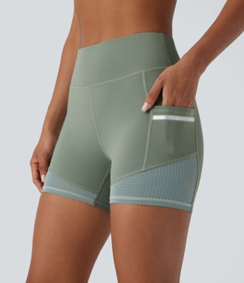 Short de sport SoftlyZero™ Airy taille haute 10 cm avec bandes réfléchissantes contrastées, empiècements ajourés et poches latérales à effet frais InstantCool