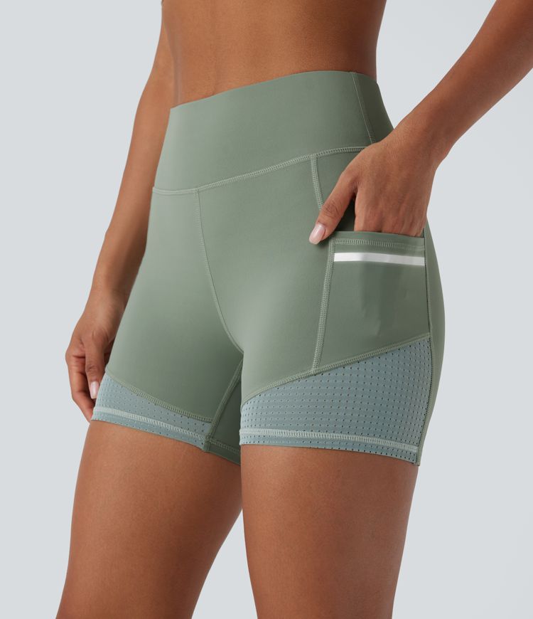 Short de sport SoftlyZero™ Airy taille haute 10 cm avec bandes réfléchissantes contrastées, empiècements ajourés et poches latérales à effet frais InstantCool