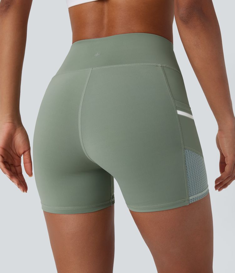 Short de sport SoftlyZero™ Airy taille haute 10 cm avec bandes réfléchissantes contrastées, empiècements ajourés et poches latérales à effet frais InstantCool