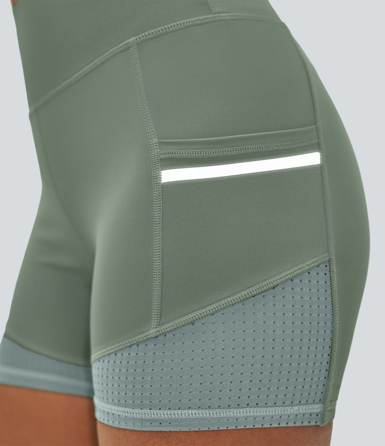 Short de sport SoftlyZero™ Airy taille haute 10 cm avec bandes réfléchissantes contrastées, empiècements ajourés et poches latérales à effet frais InstantCool