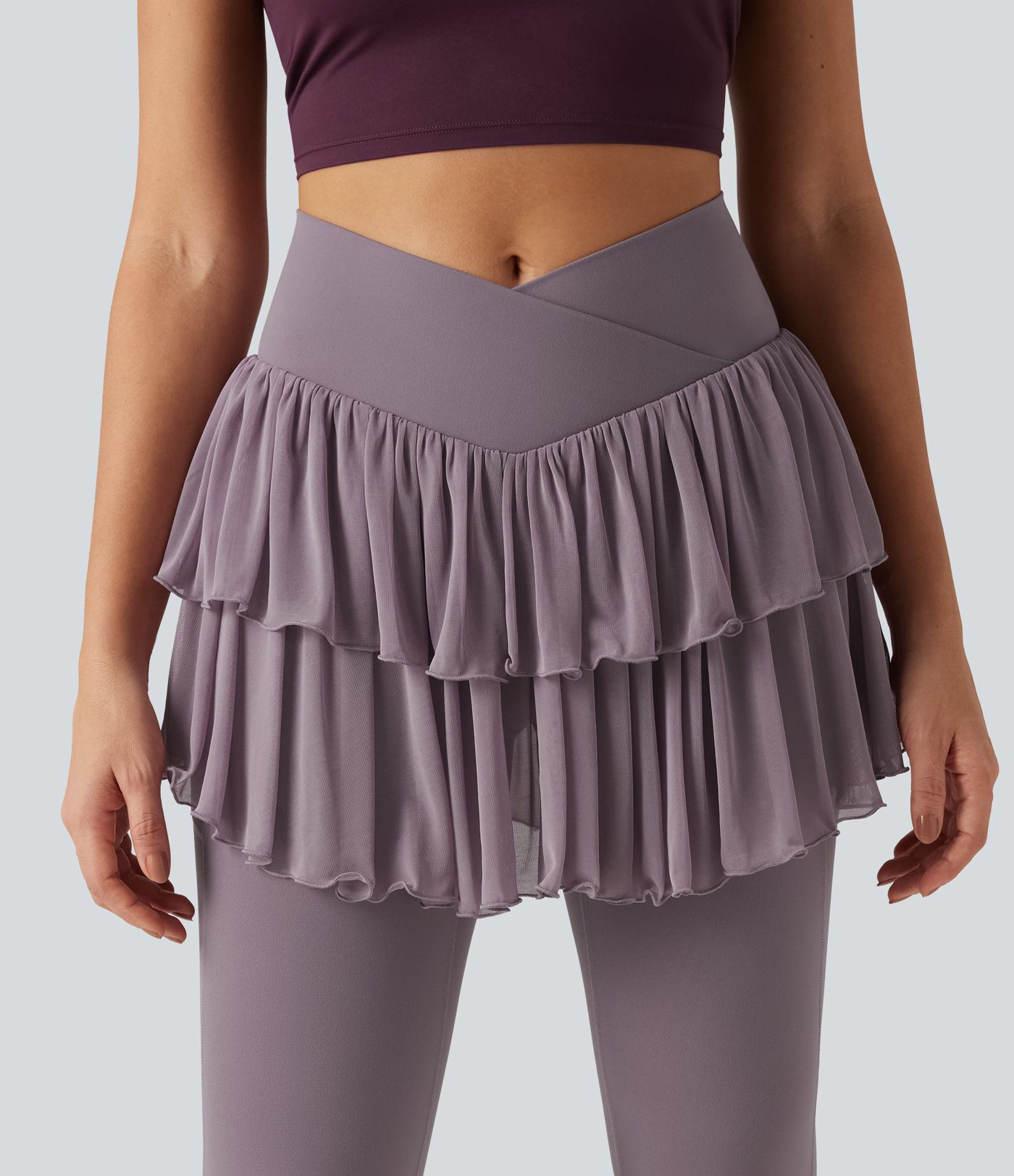 Legging-jupe de sport SoftlyZero™ taille haute croisée avec mesh contrasté et poches Legging-jupe de sport SoftlyZero™ taille haute croisée avec mesh contrasté et poches
