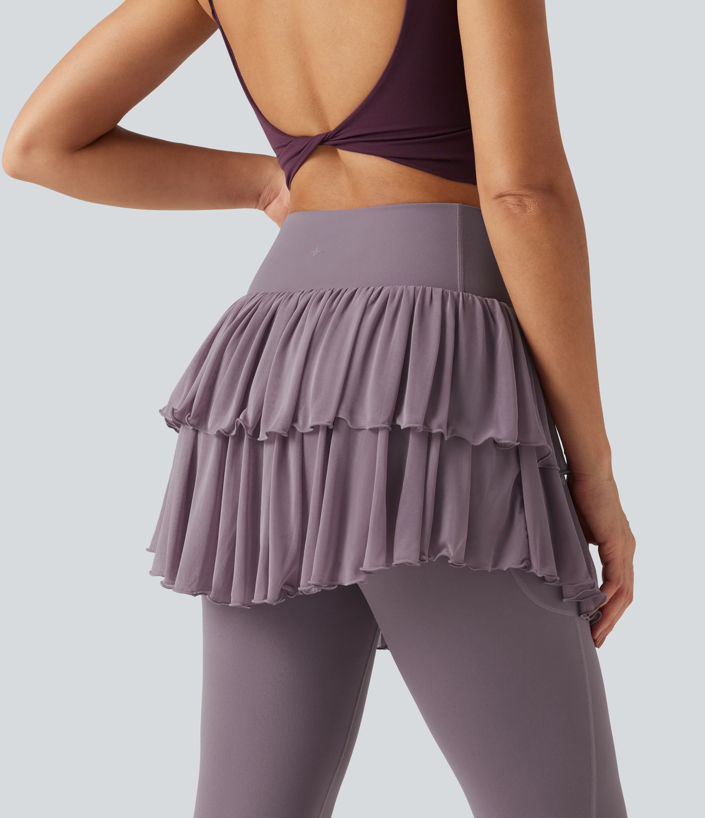 Legging-jupe de sport SoftlyZero™ taille haute croisée avec mesh contrasté et poches Legging-jupe de sport SoftlyZero™ taille haute croisée avec mesh contrasté et poches