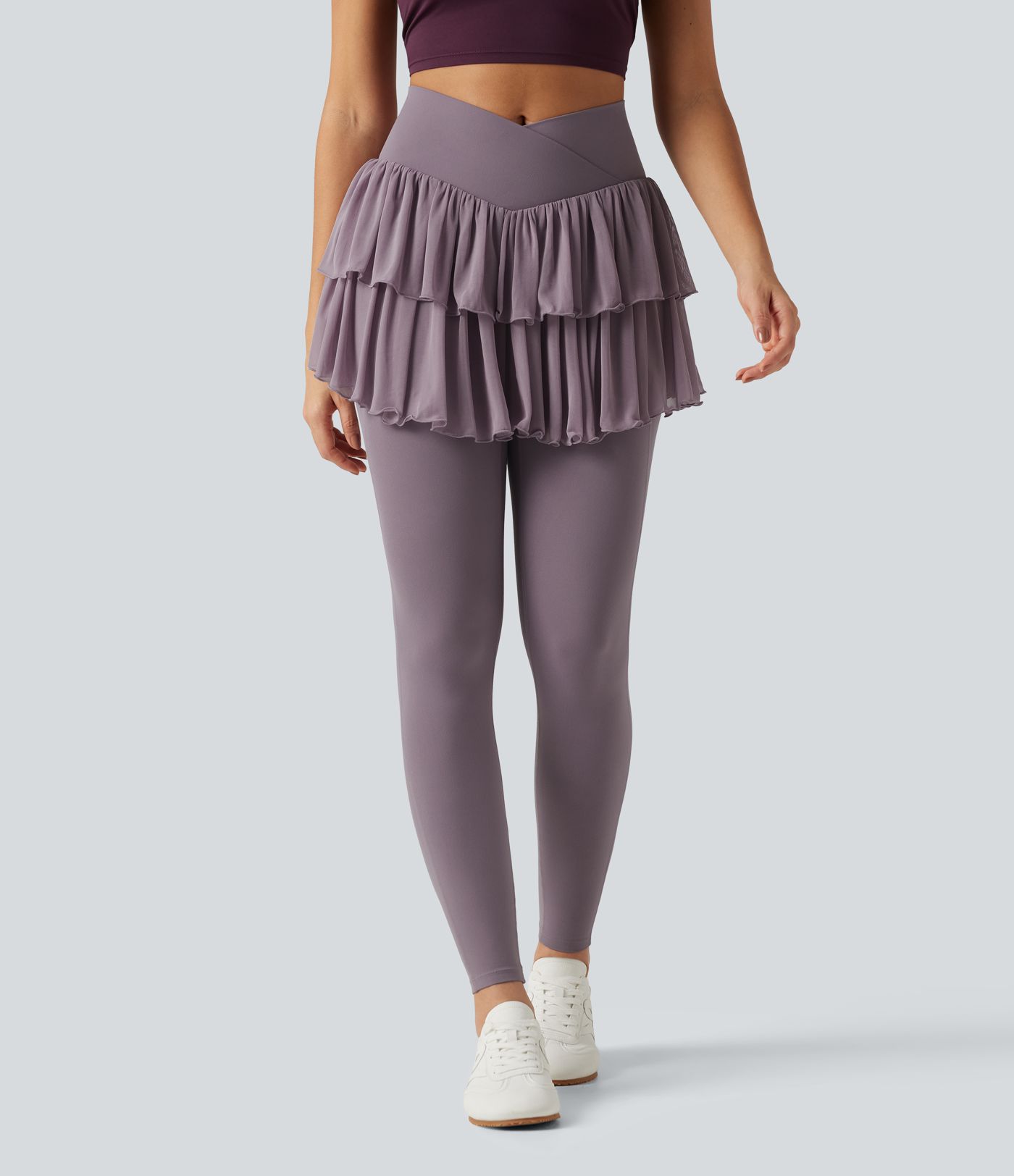 Legging-jupe de sport SoftlyZero™ taille haute croisée avec mesh contrasté et poches Legging-jupe de sport SoftlyZero™ taille haute croisée avec mesh contrasté et poches