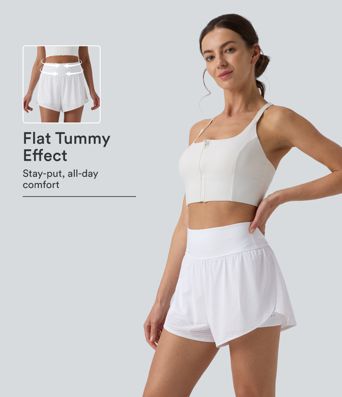 High Waisted, bauchformende 2-in-1-Yoga-Shorts mit Ösen, reflektierenden Punkten, überlappendem geschwungenem Saum und Taschen.