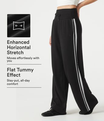 Pantalon baggy décontracté côtelé à taille haute, gainant au niveau du ventre, à cordon de serrage, avec bande latérale et poches.
