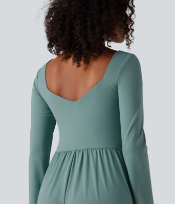 Vestido midi casual de manga larga con sujetador integrado, escote cruzado, corte fluido y bolsillos