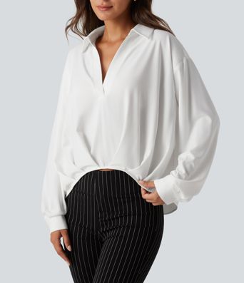 Bluse mit Kragen, langen Ärmeln und abgerundetem Saum Bluse mit Kragen, langen Ärmeln und abgerundetem Saum