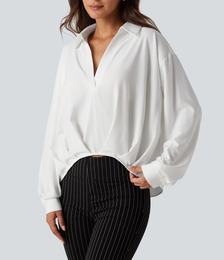 Bluse mit Kragen, langen Ärmeln und abgerundetem Saum Bluse mit Kragen, langen Ärmeln und abgerundetem Saum