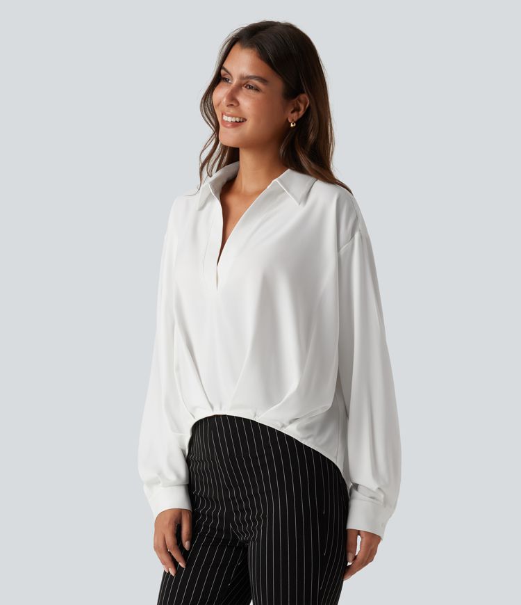 Bluse mit Kragen, langen Ärmeln und abgerundetem Saum Bluse mit Kragen, langen Ärmeln und abgerundetem Saum