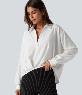 Bluse mit Kragen, langen Ärmeln und abgerundetem Saum Bluse mit Kragen, langen Ärmeln und abgerundetem Saum