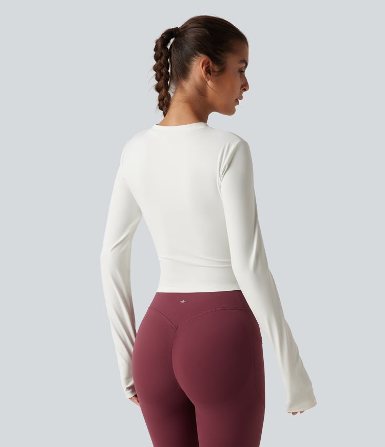 Gerafftes Yoga-Sport-Top mit Rundhalsausschnitt, langen Ärmeln und Daumenlöchern Gerafftes Yoga-Sport-Top mit Rundhalsausschnitt, langen Ärmeln und Daumenlöchern
