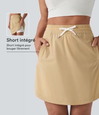 Jupe-short golf mini 2-en-1 taille haute à cordon de serrage et ourlet arrondi avec poches - Longueur plus longue