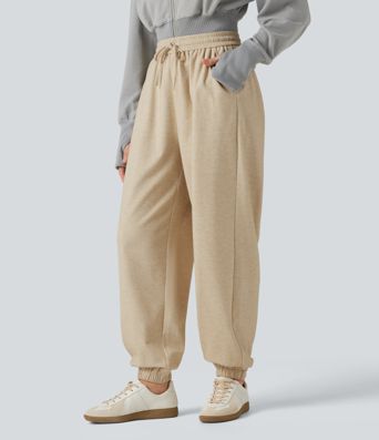Lässige Jogginghose mit hohem Bund, Seitentaschen und Kordelzug Lässige Jogginghose mit hohem Bund, Seitentaschen und Kordelzug