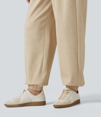 Lässige Jogginghose mit hohem Bund, Seitentaschen und Kordelzug Lässige Jogginghose mit hohem Bund, Seitentaschen und Kordelzug