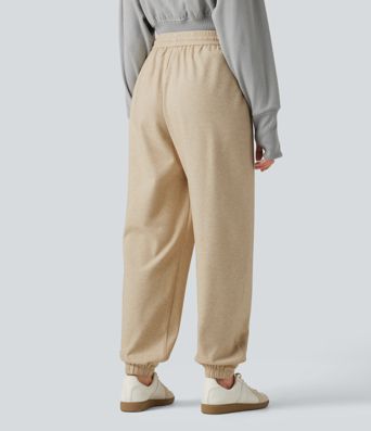 Lässige Jogginghose mit hohem Bund, Seitentaschen und Kordelzug Lässige Jogginghose mit hohem Bund, Seitentaschen und Kordelzug
