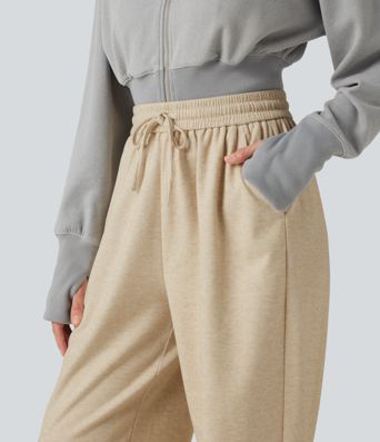 Lässige Jogginghose mit hohem Bund, Seitentaschen und Kordelzug Lässige Jogginghose mit hohem Bund, Seitentaschen und Kordelzug