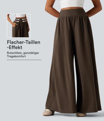 Lässige Baggy-Hose mit hohem Bund, Seitentaschen und Bauchkontrolle Lässige Baggy-Hose mit hohem Bund, Seitentaschen und Bauchkontrolle
