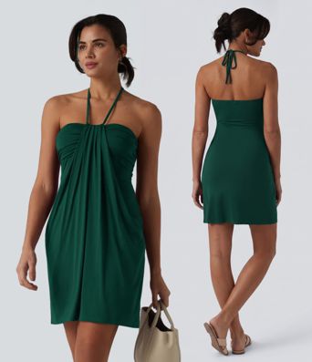 Robe resort mini dos nu à col licou avec lien noué dans le dos et poches