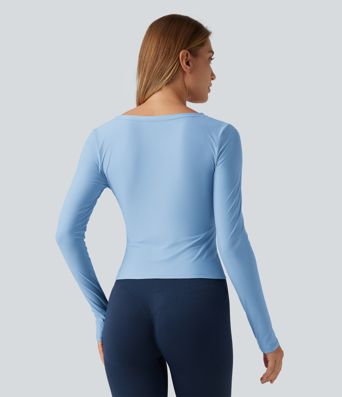 Top de yoga à encolure en V profonde, manches longues et coupe croisée