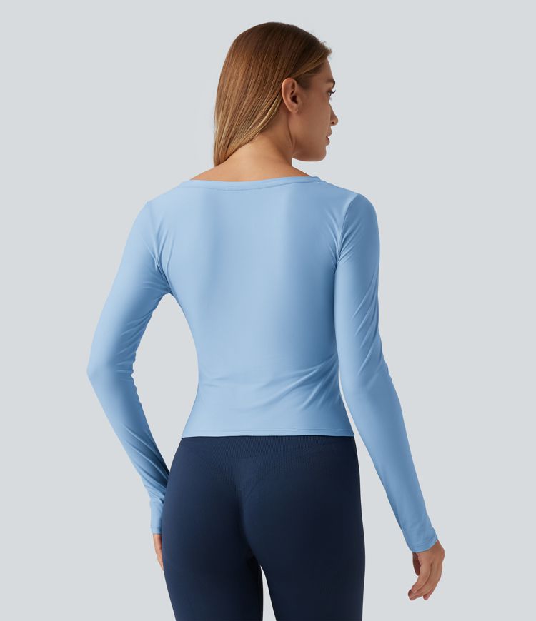 Top de yoga à encolure en V profonde, manches longues et coupe croisée