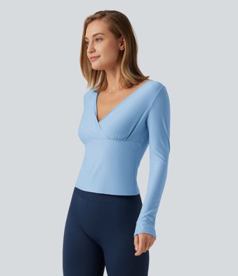 Top de yoga à encolure en V profonde, manches longues et coupe croisée