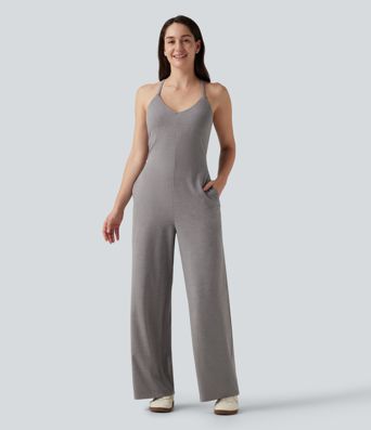 Combinaison à encolure en U, sans manches, dos croisé et coupe droite avec poches Combinaison à encolure en U, sans manches, dos croisé et coupe droite avec poches