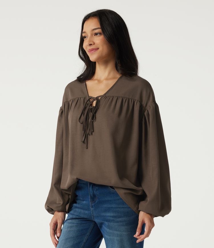 Casual blouse with V-neck, long sleeves, dropped shoulders, and a front lace-up Casual blouse with V-neck, long sleeves, dropped shoulders, and a front lace-up