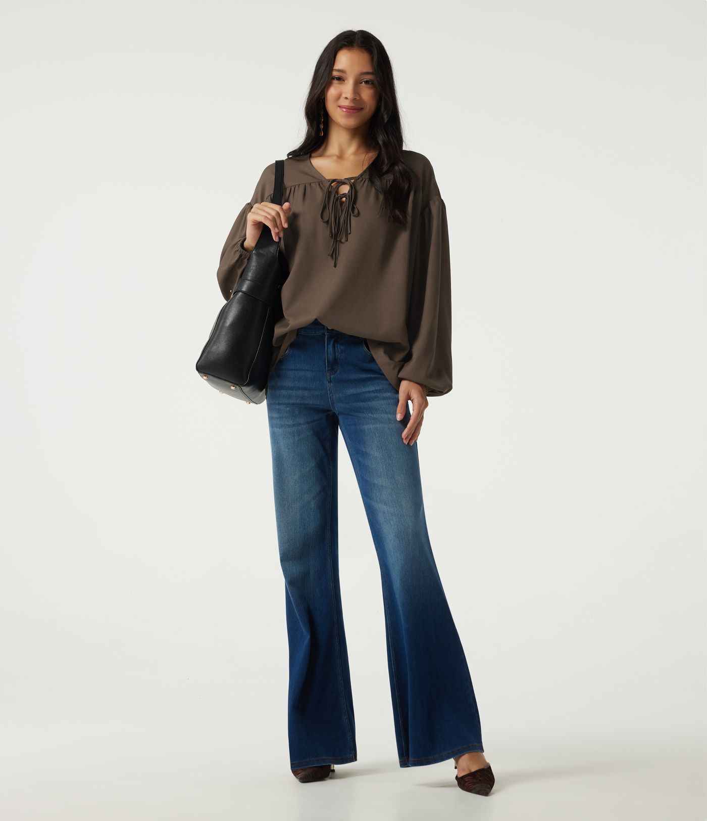 Casual blouse with V-neck, long sleeves, dropped shoulders, and a front lace-up Casual blouse with V-neck, long sleeves, dropped shoulders, and a front lace-up