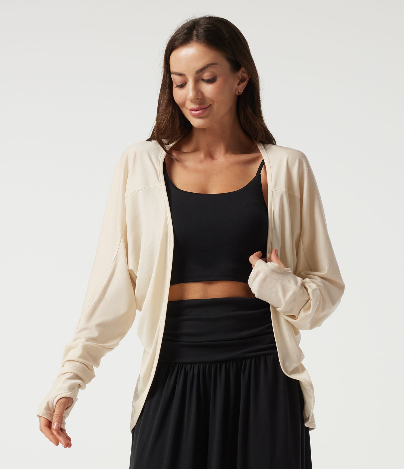 Lässige Strickjacke mit langen Fledermausärmeln und Daumenlöchern Lässige Strickjacke mit langen Fledermausärmeln und Daumenlöchern