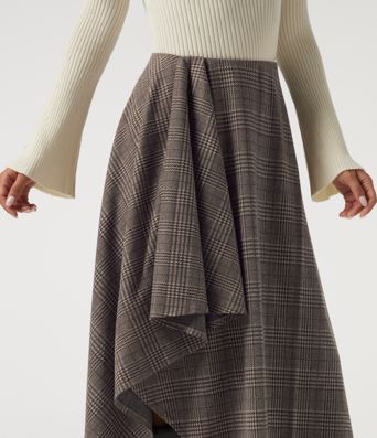 Lässiger Midirock in A-Linie mit hohem Bund, Seitentaschen, Karomuster und asymmetrischem Design Lässiger Midirock in A-Linie mit hohem Bund, Seitentaschen, Karomuster und asymmetrischem Design