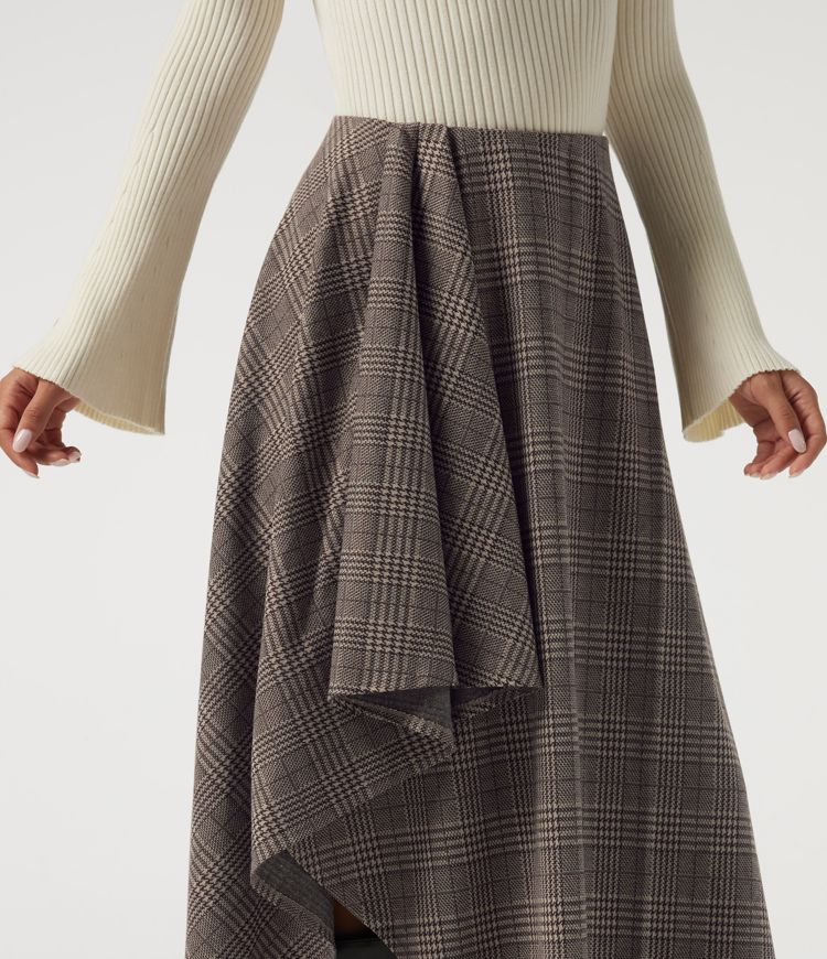 Lässiger Midirock in A-Linie mit hohem Bund, Seitentaschen, Karomuster und asymmetrischem Design Lässiger Midirock in A-Linie mit hohem Bund, Seitentaschen, Karomuster und asymmetrischem Design