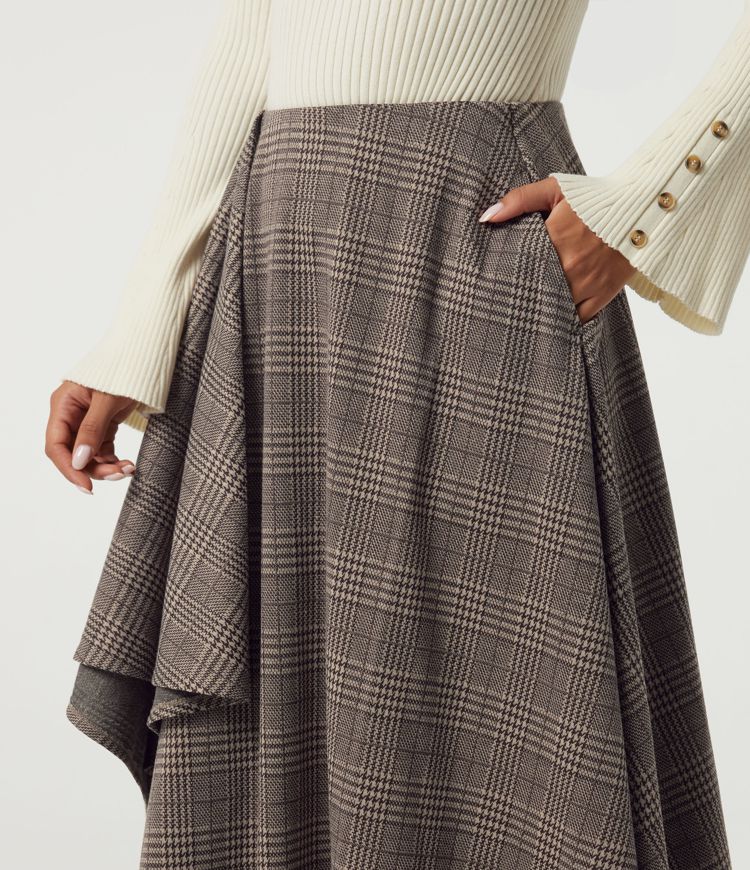 Lässiger Midirock in A-Linie mit hohem Bund, Seitentaschen, Karomuster und asymmetrischem Design Lässiger Midirock in A-Linie mit hohem Bund, Seitentaschen, Karomuster und asymmetrischem Design